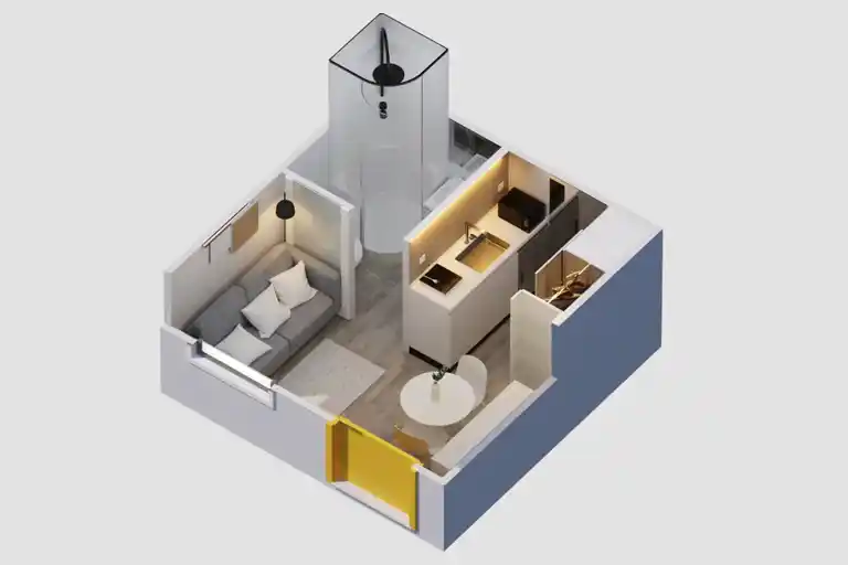 Inside the compact space, featuring a kitchen, bathroom, and pull-out bed.
