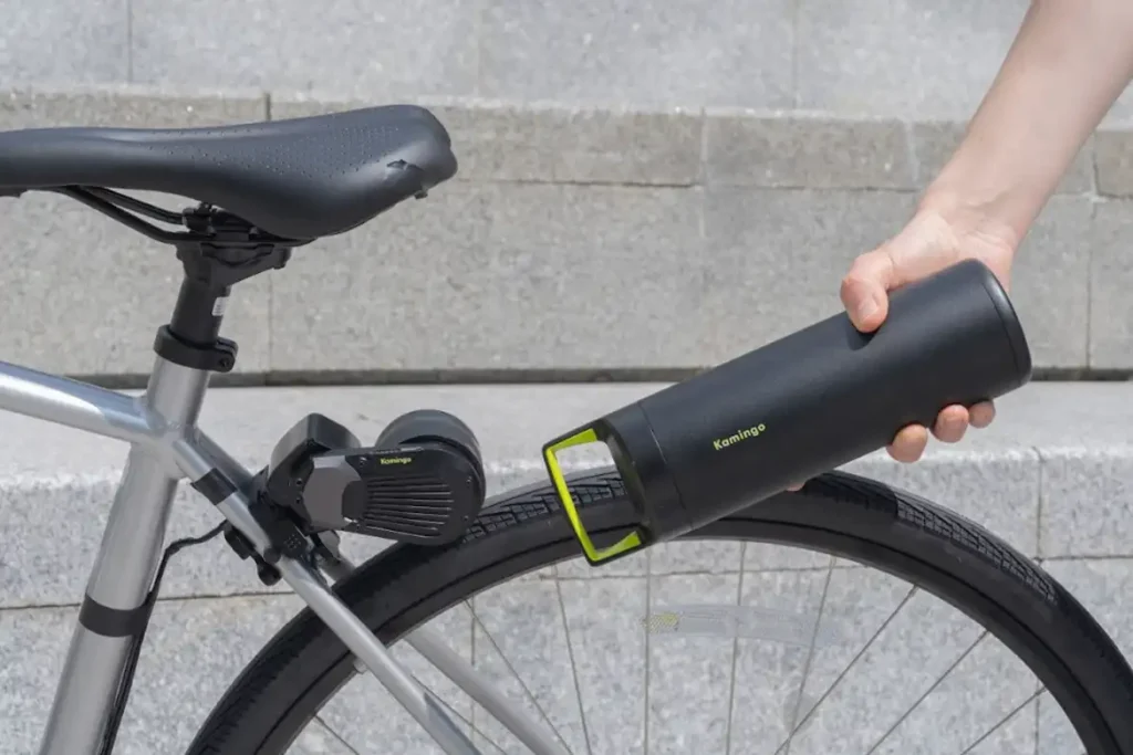 The full Kamingo e-bike kitsetup: handlebar controller, bottle-cage battery, and rear motor.