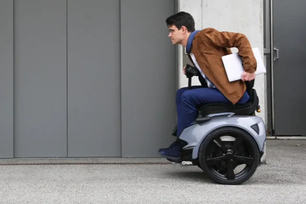 Genny Zero self-balancing wheelchair scooter features a handlebar-free design, controlled entirely by body movement.